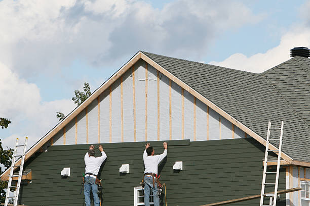 Professional Siding technician working in Staley, NC